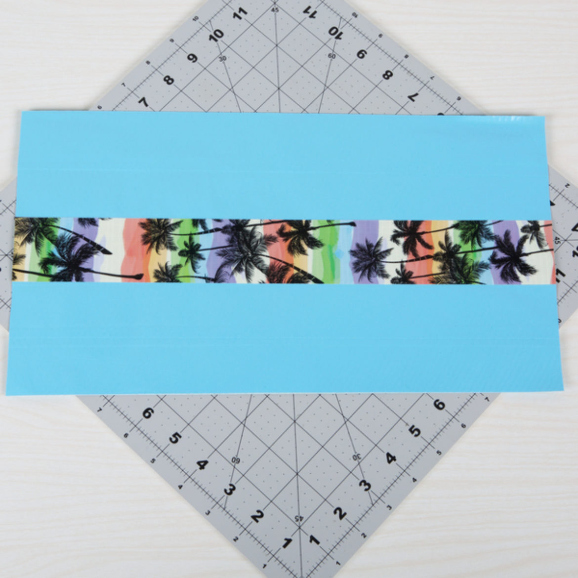 Design strip of Tape affixed to the center of the fabric